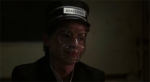 "Oh, you mean this mask? Just part of a brakeman's uniform, honey."